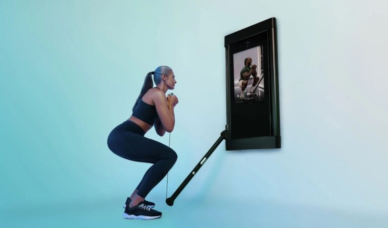 A woman doing a squat using the new Tonal 2 machine