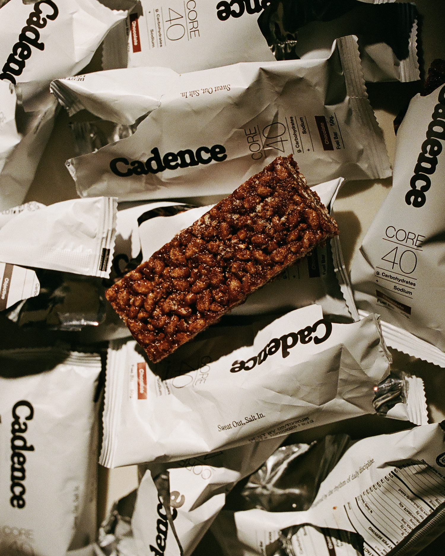 Cadence nutrition bar on top of a pile of wrappers