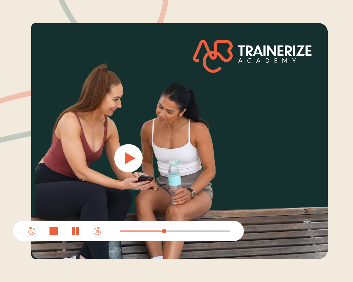 Graphic of a fitness trainer and client using trainerize academy on their smartphone
