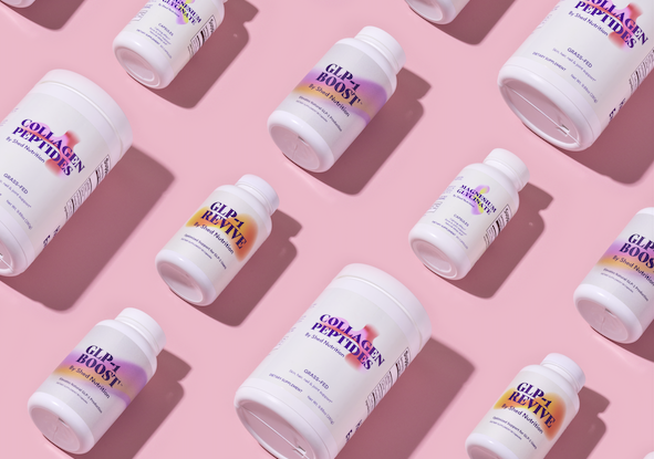 Array of prescription bottles on a light pink background