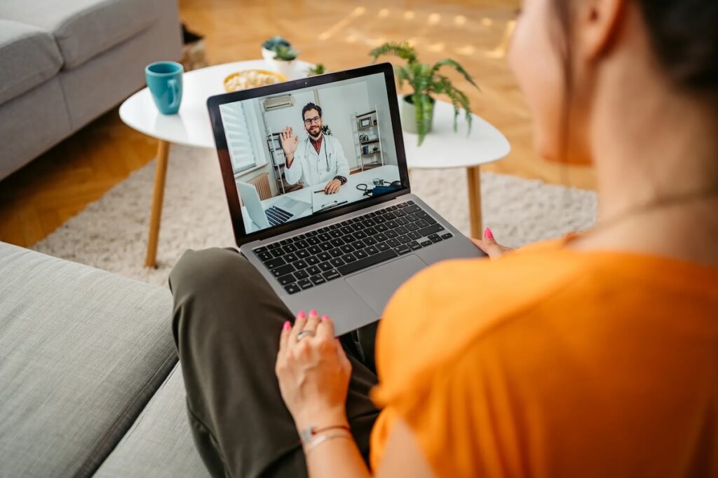 Young woman having a doctors appointment online