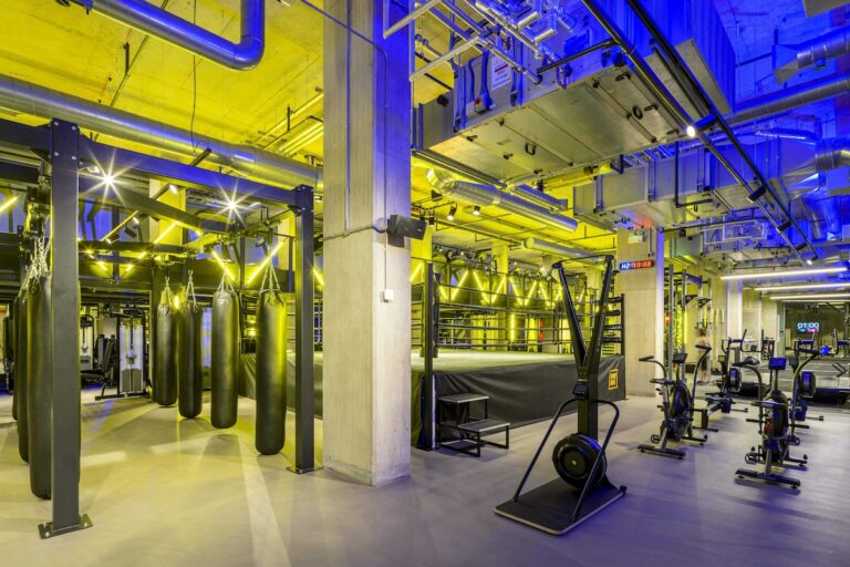 Gym floor with stationary bikes and punching bags