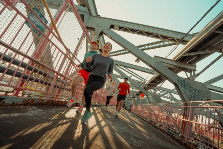Group of runners on a bridge