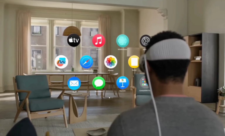 A man is wearing a virtual reality headset and viewing app icons