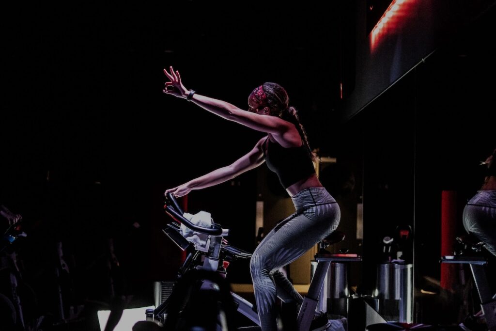 CycleBar instructor counting down with her fingers