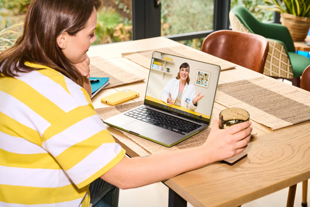 A woman and a physician on a virtual meeting