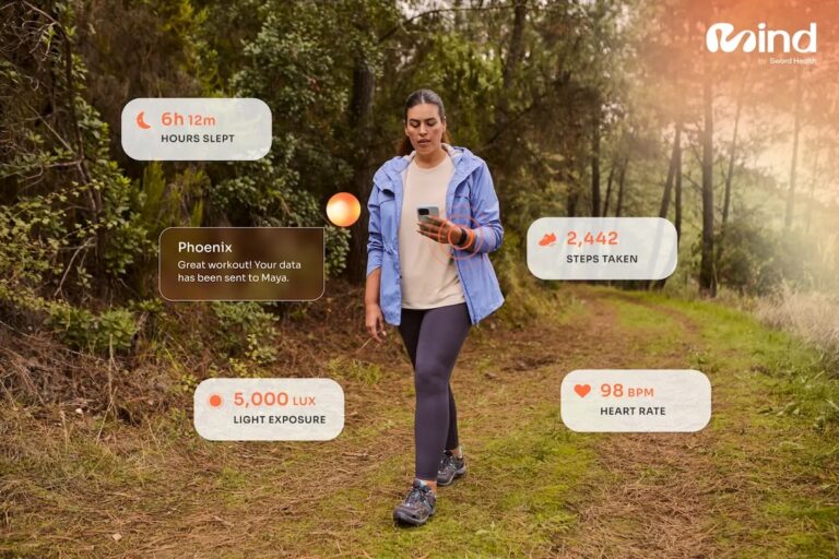 A woman receiving health insights on her phone while walking in nature