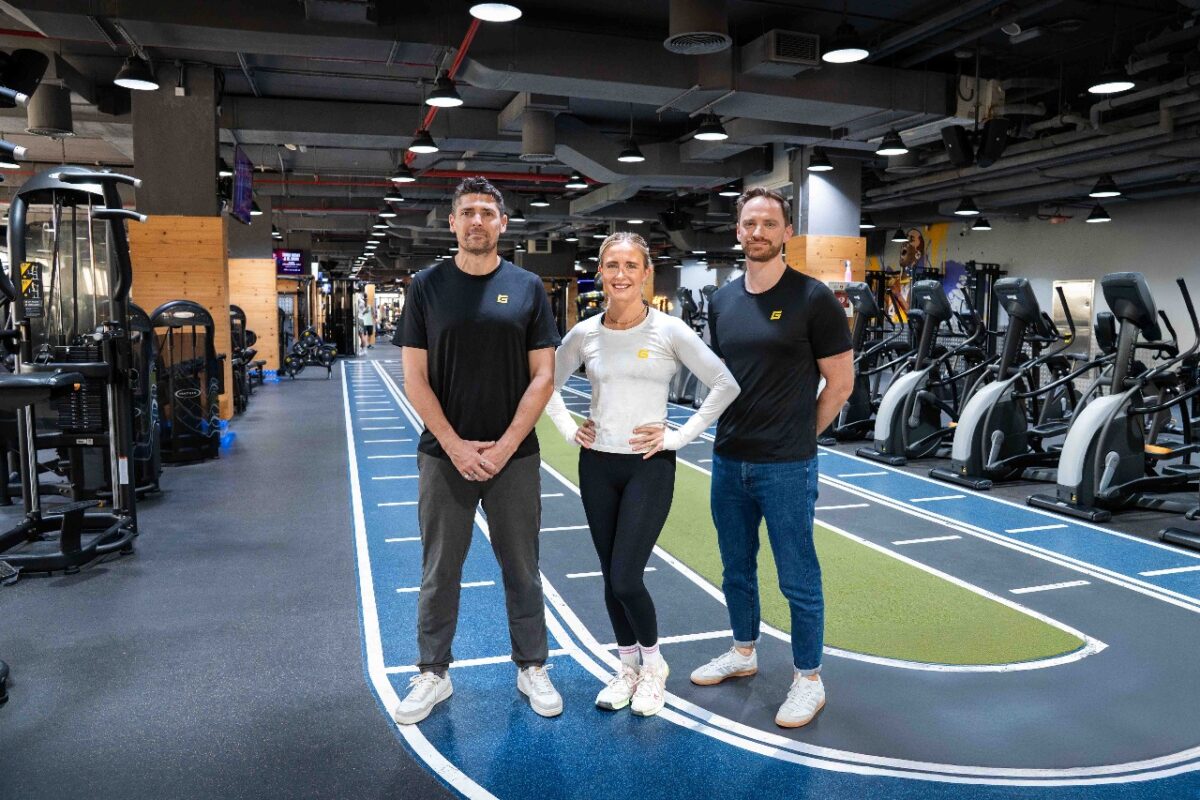GymNation's new hires posing in an indoor fitness facility