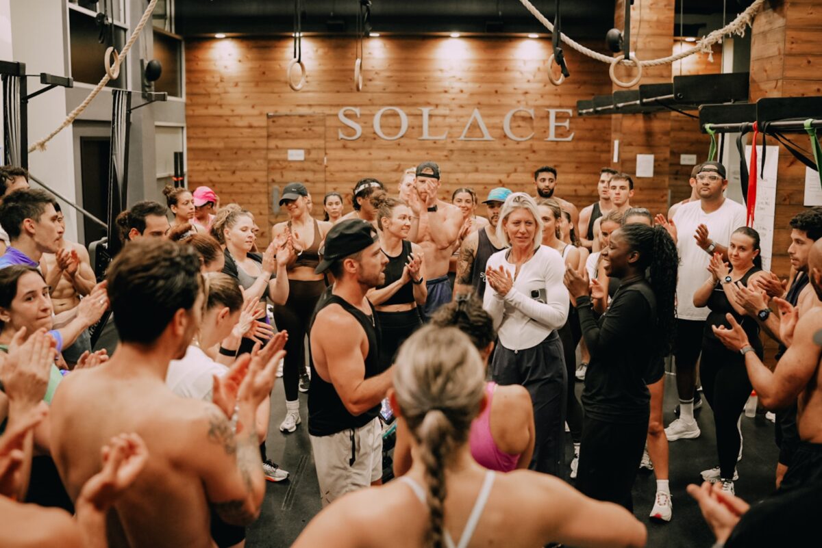 Group of people clapping at Solace House