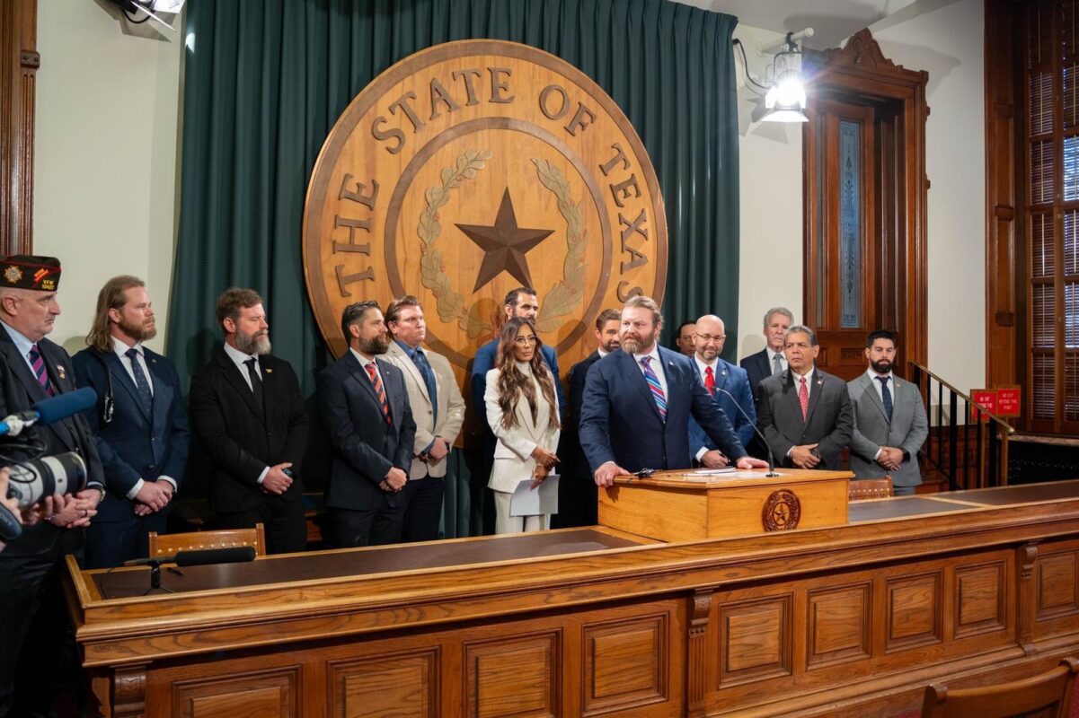Bryan Hubbard speaks at the Texas Capitol during a 2025 Day of Action, surrounded by Texas Veterans who found healing through ibogaine and called for state-funded clinical research.