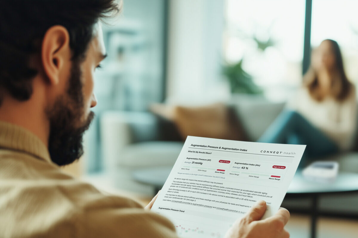 A man reading a health report on paper
