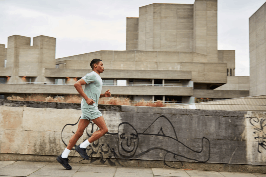 A man in Acid Running gear running in the street