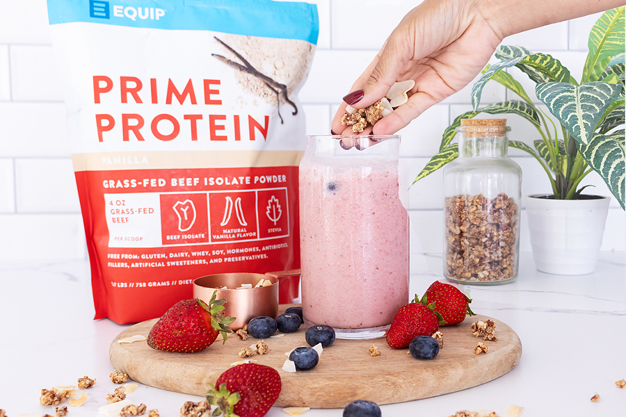 Bag of Prime Protein and a pink berry smoothie