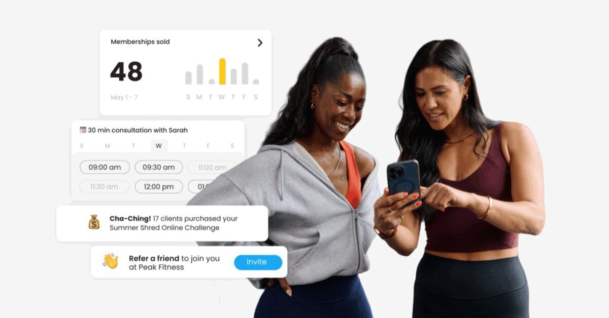 Two female trainers checking business metrics on mobile