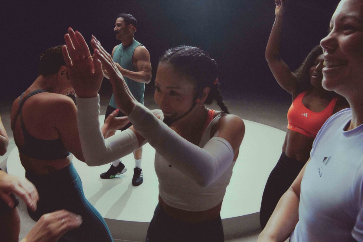A fitness coach high-fiving a client