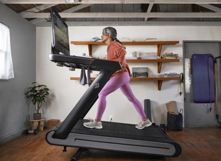 Woman walking on a treadmill at an incline