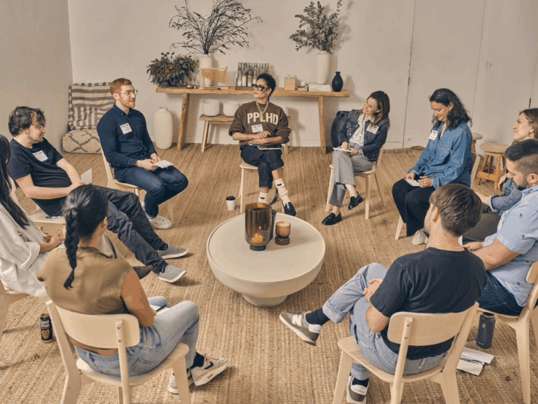 Group of people sitting on chairs in a circle