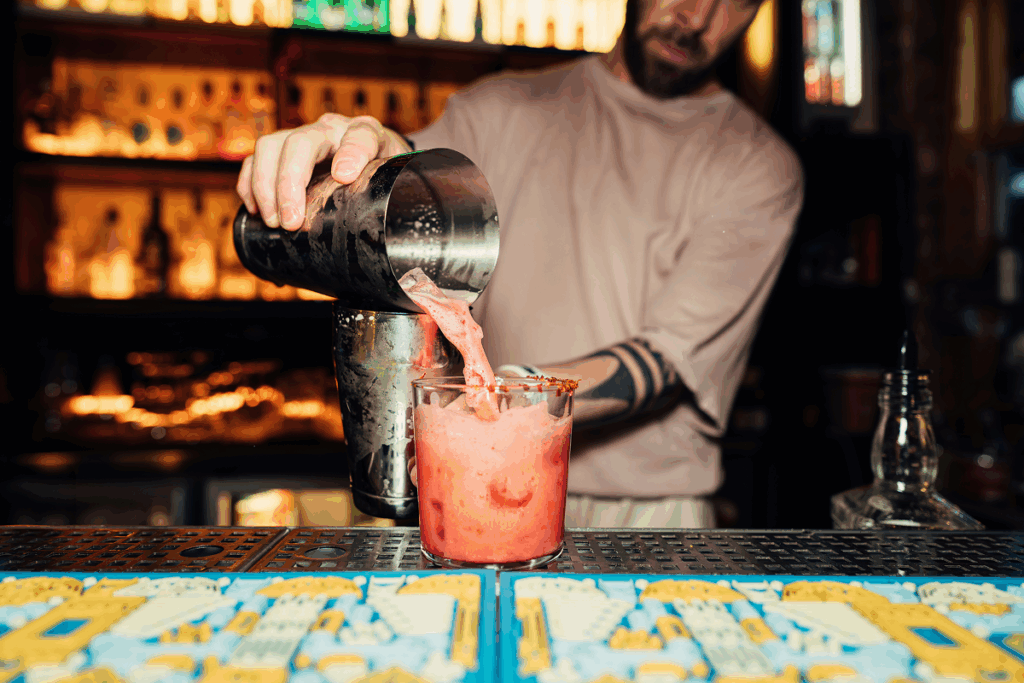 Bartender pouring a mixed drink