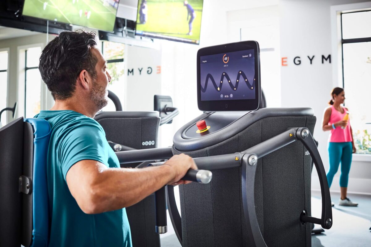 Man using EGYM seated row equipment