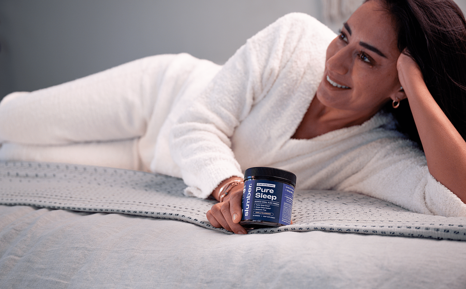 Woman holding Slumber's Pure Sleep™ Gummies