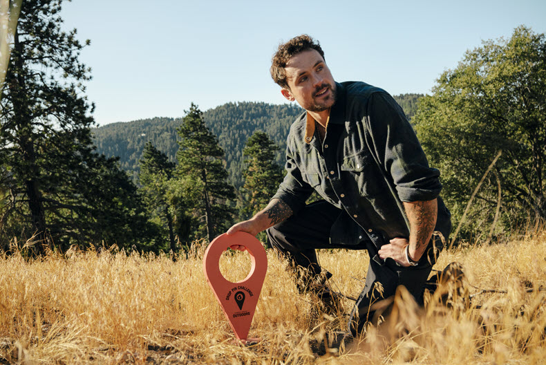 Man dropping a location pin in real life