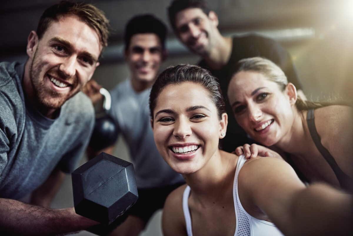 Happy millennial and Gen Z gym-goers