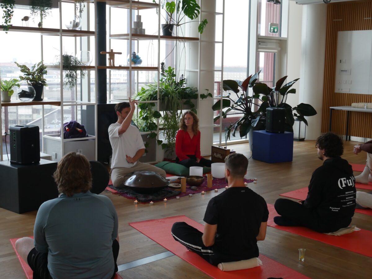 Man and woman leading a breathwork class