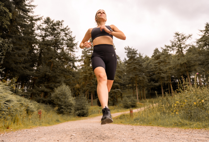 Woman running on an outdoor trail