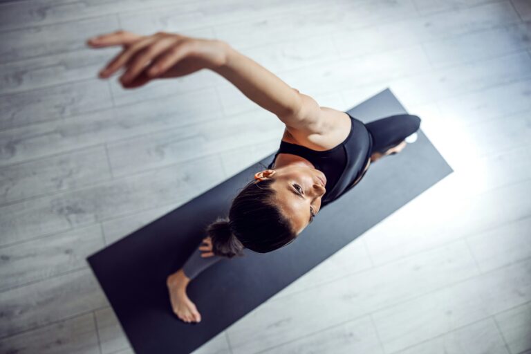 Woman doing yoga on mat