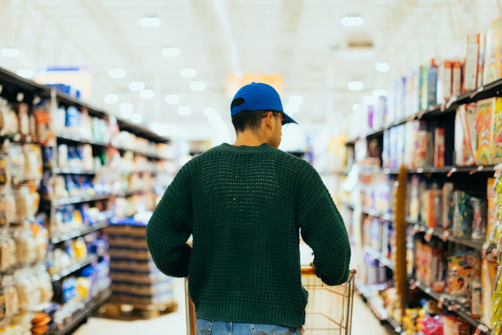 Man pushing a grocery cart