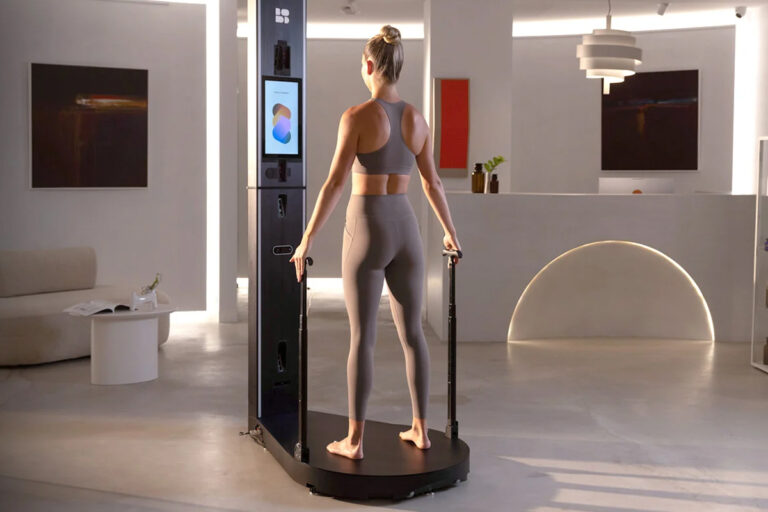 Woman using Bodd's full-body scanner