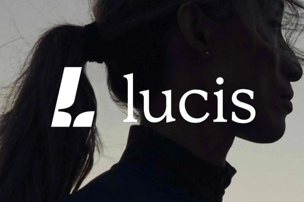 Lucis logo with a woman's silhouette in the background