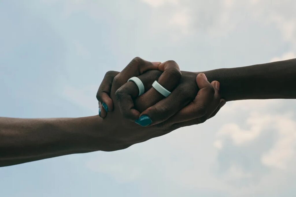 Hand holding with Oura rings