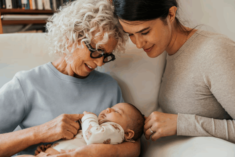 Woman and older woman holding a newborn