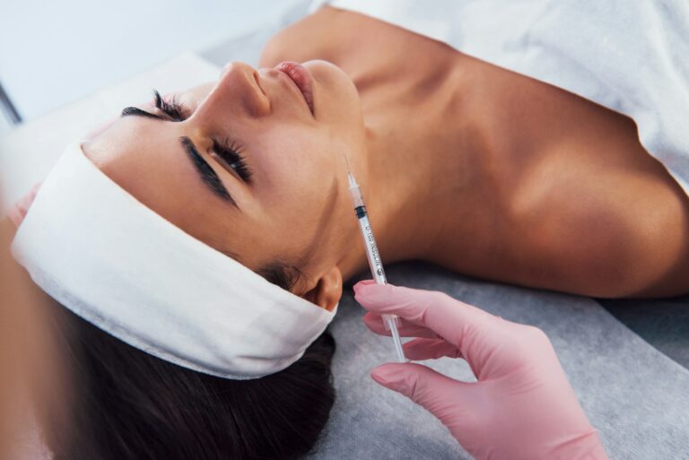 Woman receiving a medical aesthetic treatment