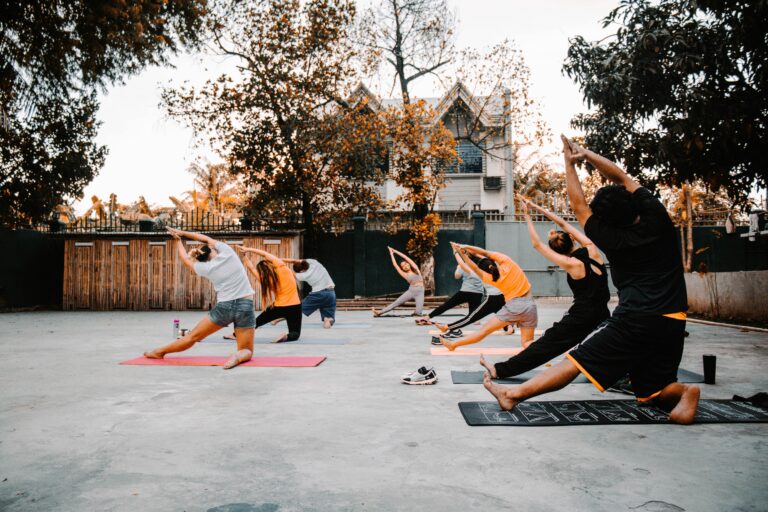 Group of people doing yoga outside