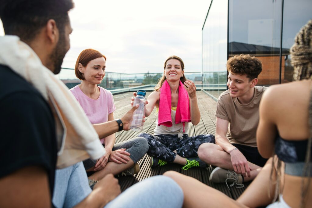 Group of exercisers taking a water break