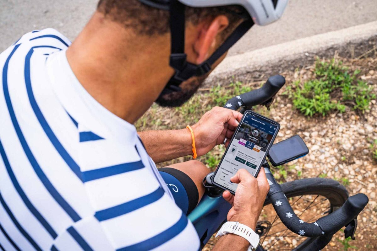 Cyclist viewing TrainingPeaks on his phone