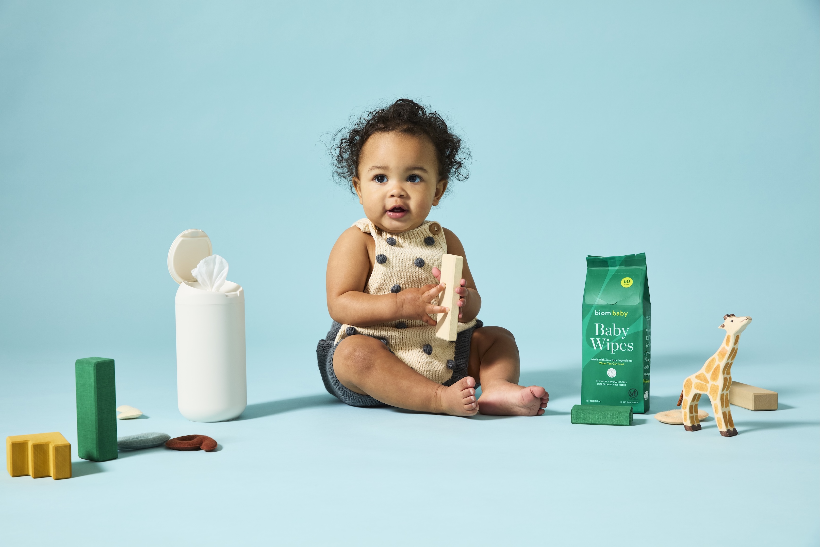Baby posing with Biom baby wipes