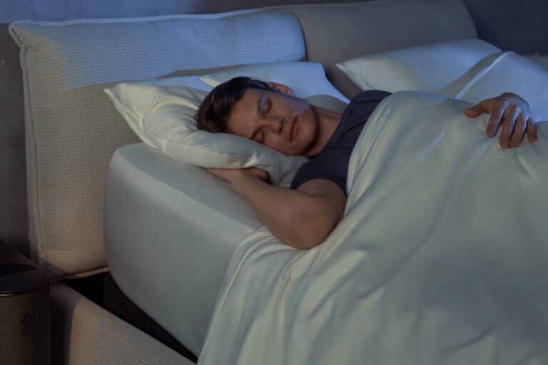 Man sleeping on an Eight Sleep mattress