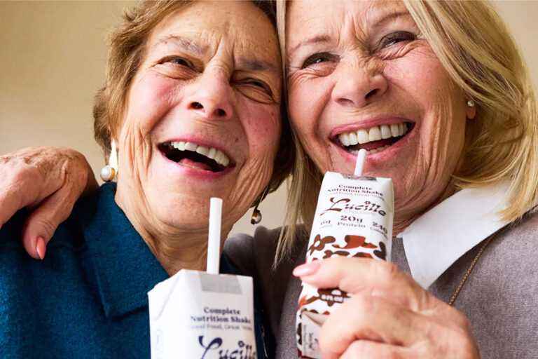 Two seniors with Lucille protein drink