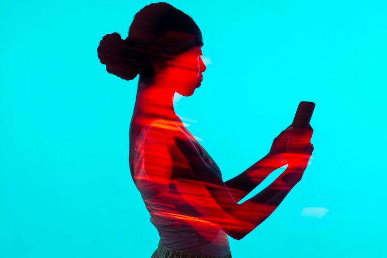 Outline of a woman on her phone