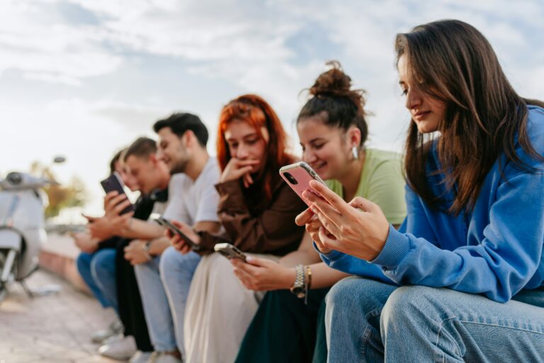 Group of young people on their phones