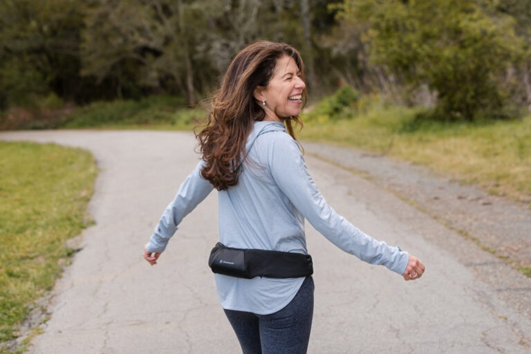Woman walking with Osteoboost's wearable