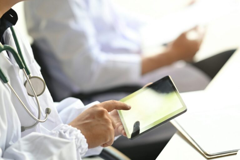 Doctor working with a tablet
