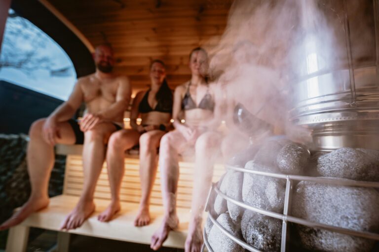 Group of people sitting in a sauna