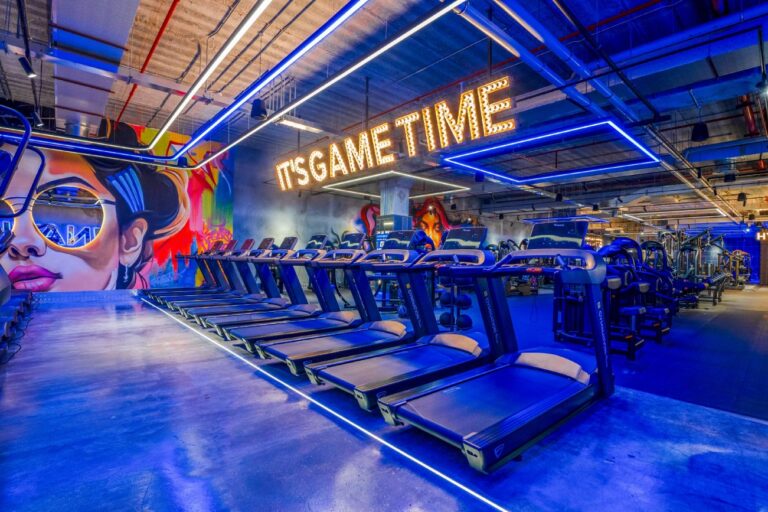 Row of treadmills at GymNation Atrium Mall