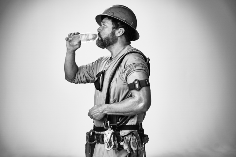 Electric worker drinking water with Epicore armband