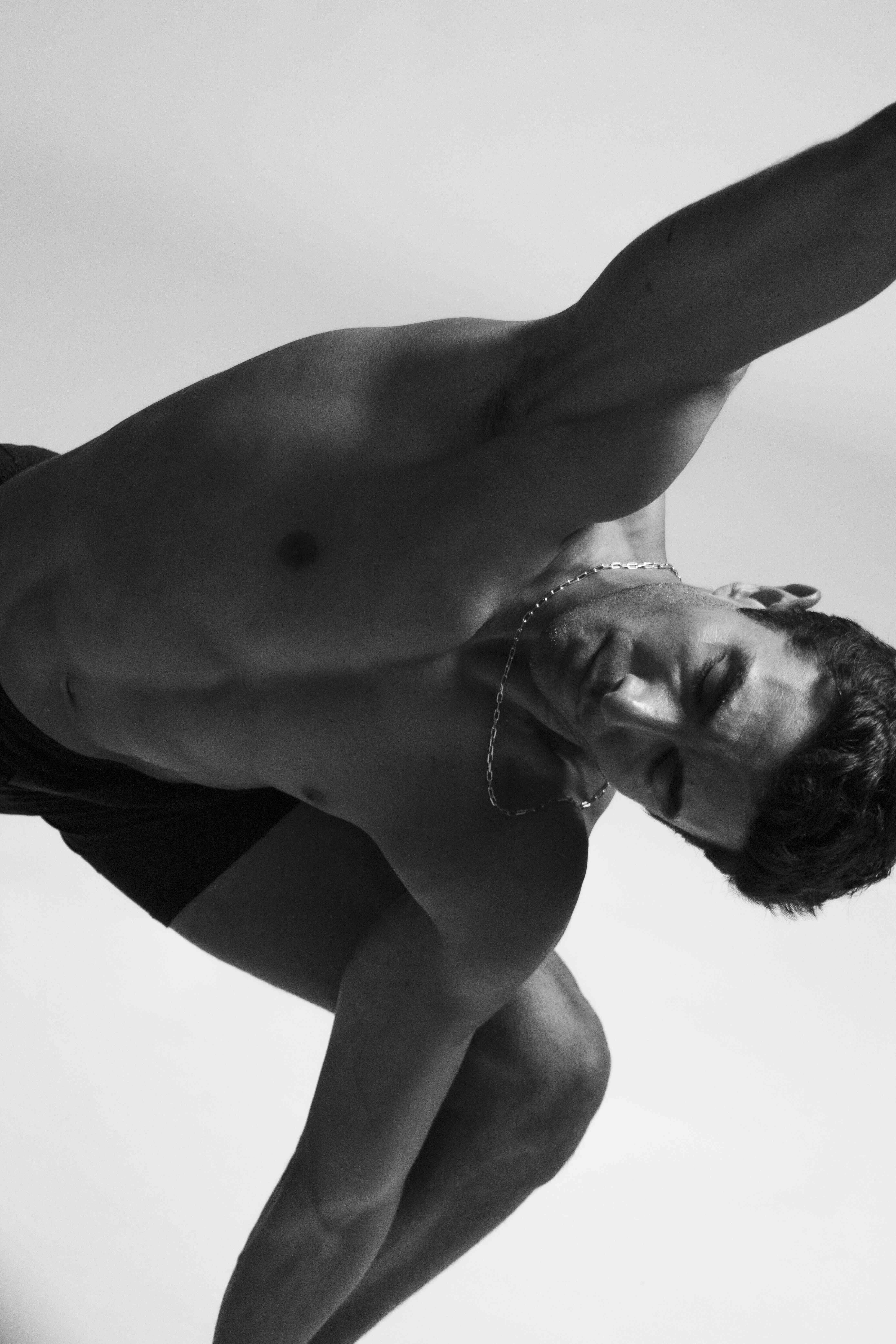 Akin Akman performing a yoga posture