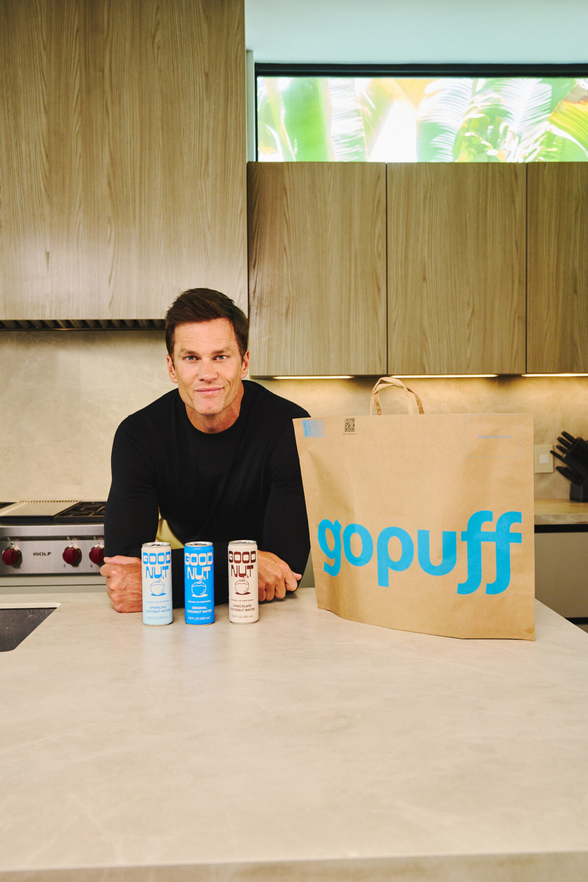 Tom Brady with Good Nut drinks and Gopuff bag